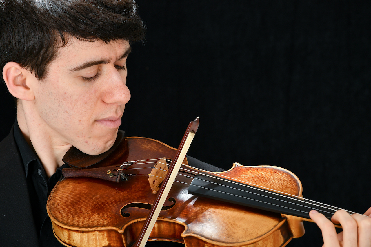 Emmanuel Bach playing a violin